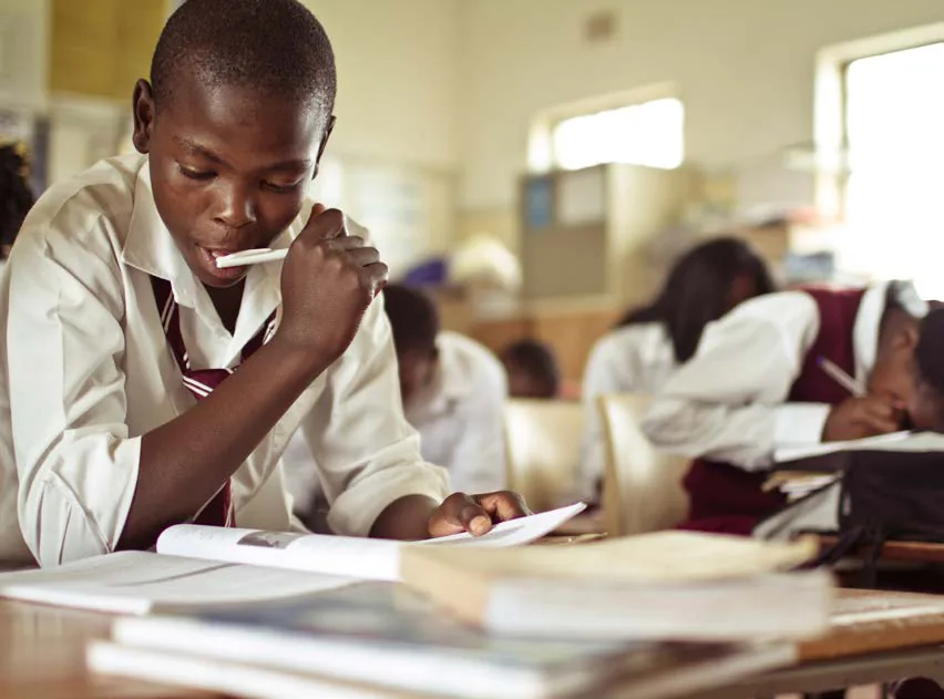 Pupil studying in a classroom at a school supported by the conservation programme near andBeyond Phinda, KwaZulu-Natal