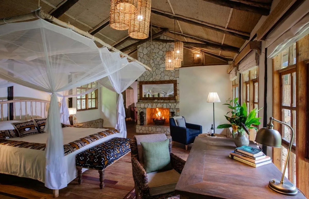 Banda interior with fireplace at Bwindi Lodge, Uganda