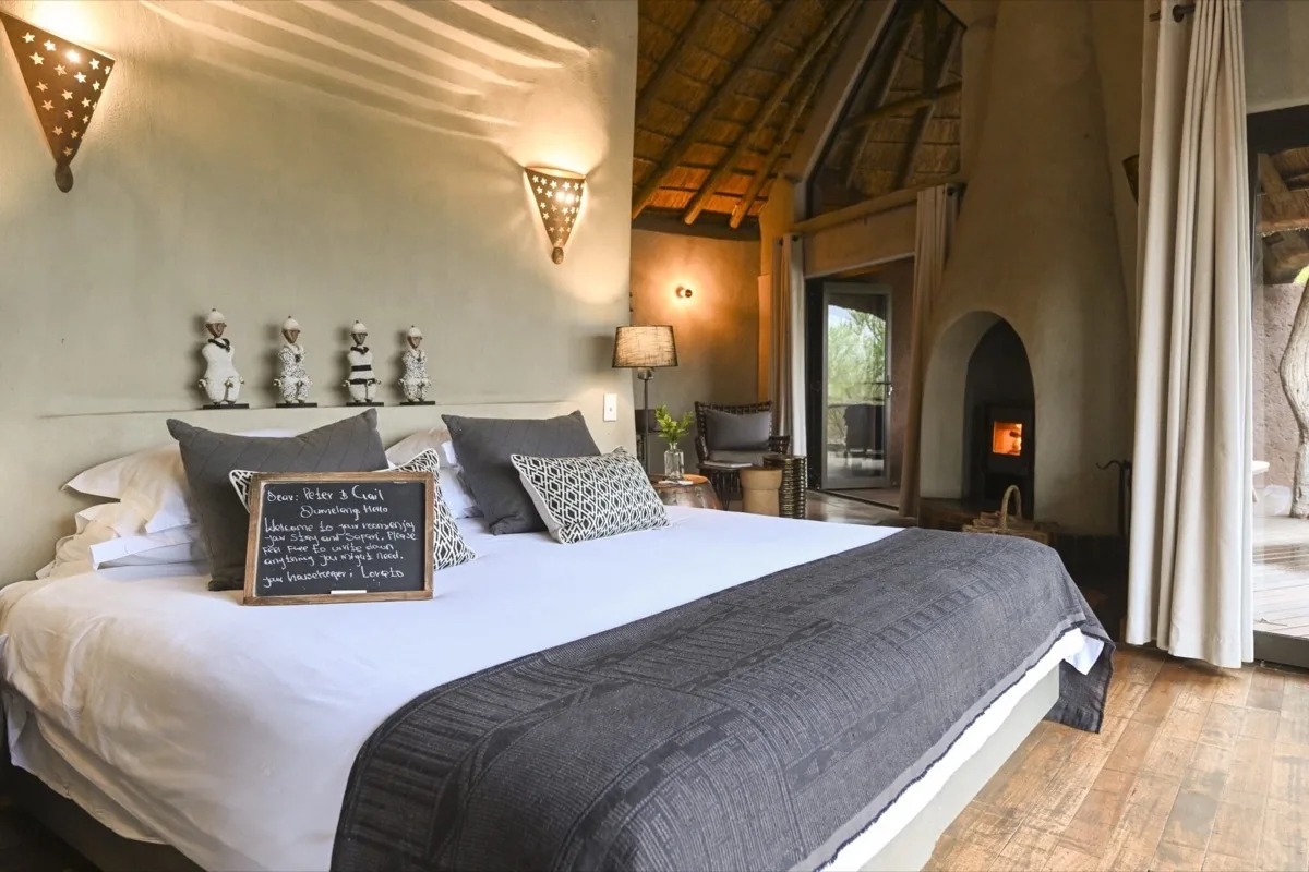 Dithaba suite with thatched ceiling and fireplace, Madikwe Safari Lodge