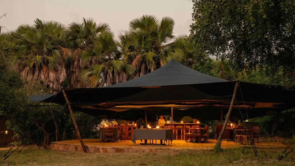Open-sided dining tent at dusk, Roho ya Selous, Nyerere National Park