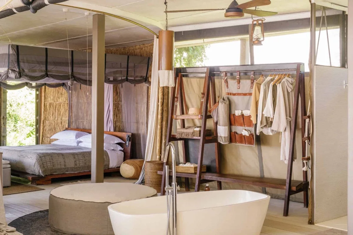 Open-fronted villa interior at Time + Tide Chinzombo, South Luangwa