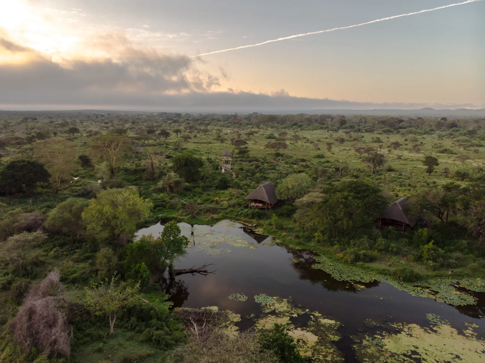 Camp and natural springs from the air at dawn, Tsavo West, Kenya