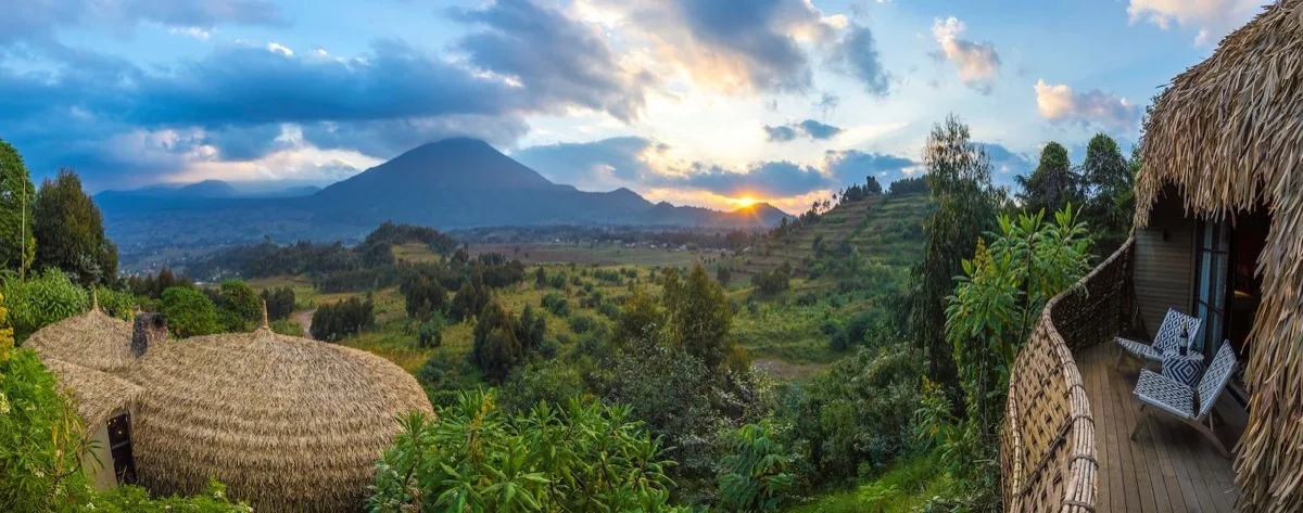 Sunrise over the Virunga volcanoes from a Bisate Lodge villa, Rwanda