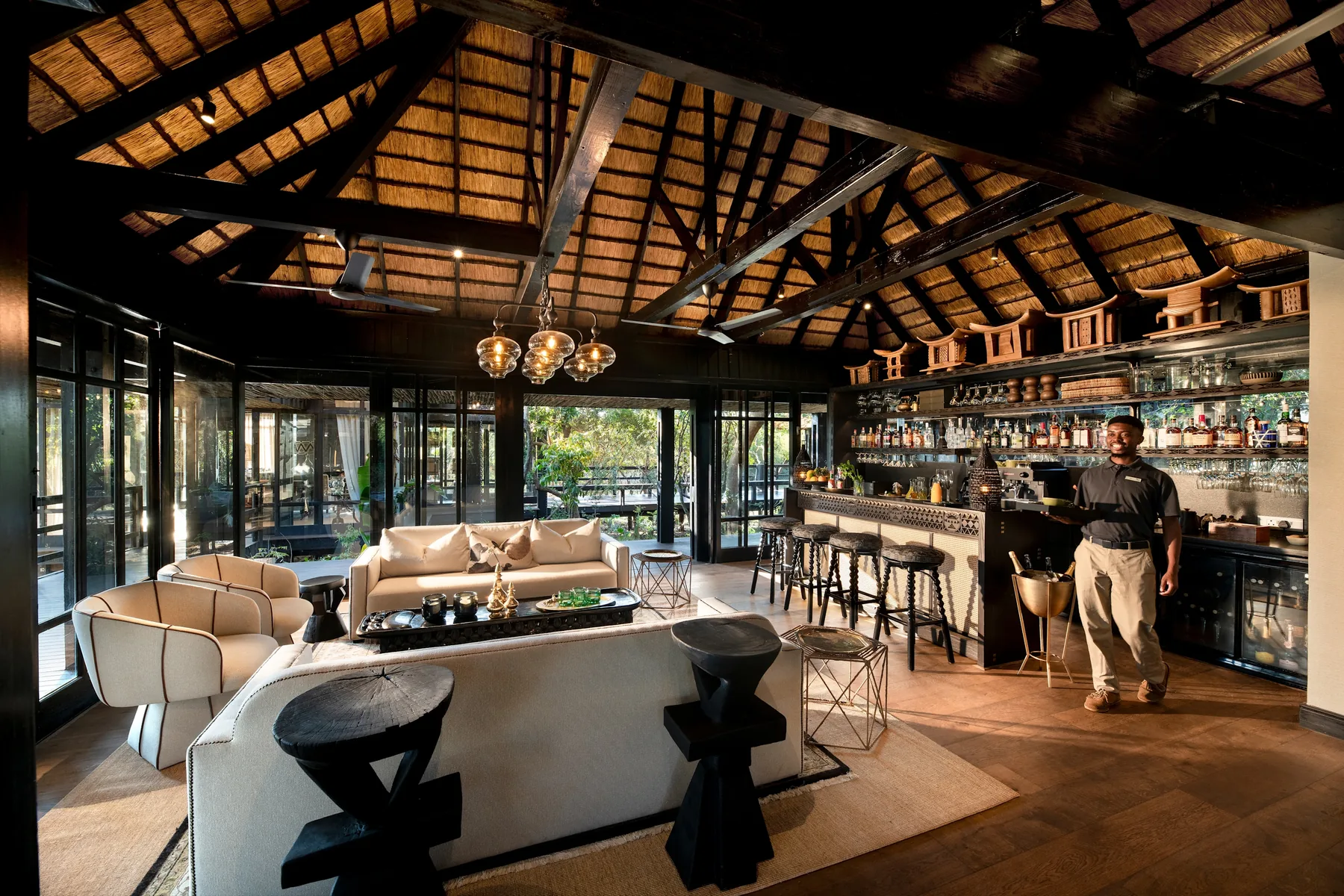 Main guest area and bar under thatch with sand forest through the windows, andBeyond Phinda Vlei Lodge