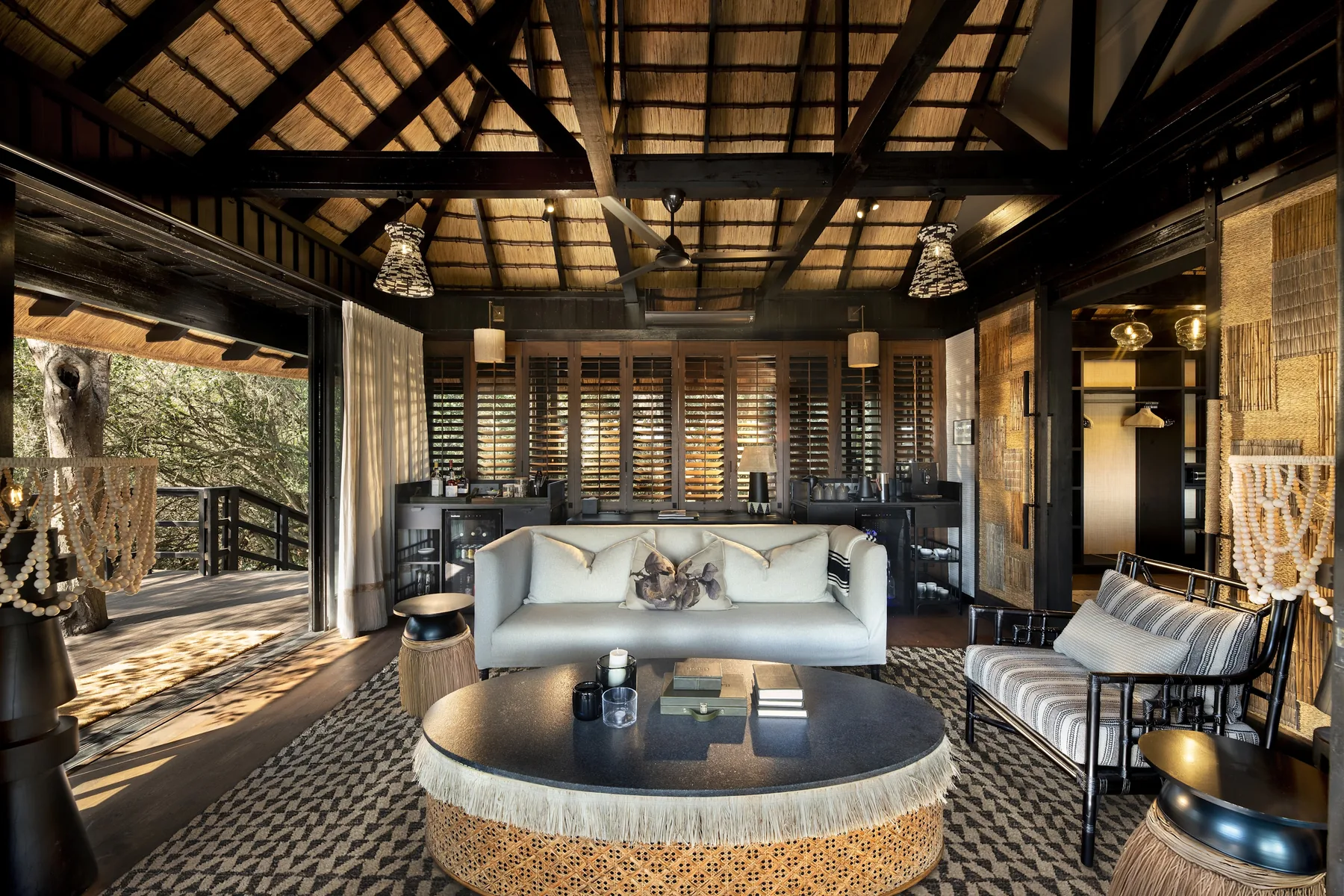 Enlarged suite sitting area with personal bar and dressing room, opening onto a private deck, andBeyond Phinda Vlei Lodge
