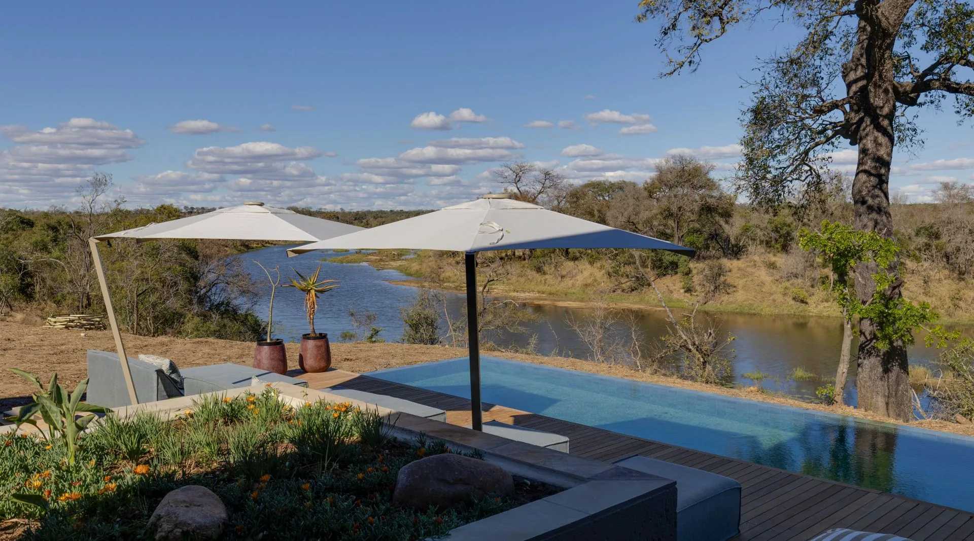 Pool terrace at Sandringham House overlooking the Timbavati River and bushveld, Sandringham Private Game Reserve